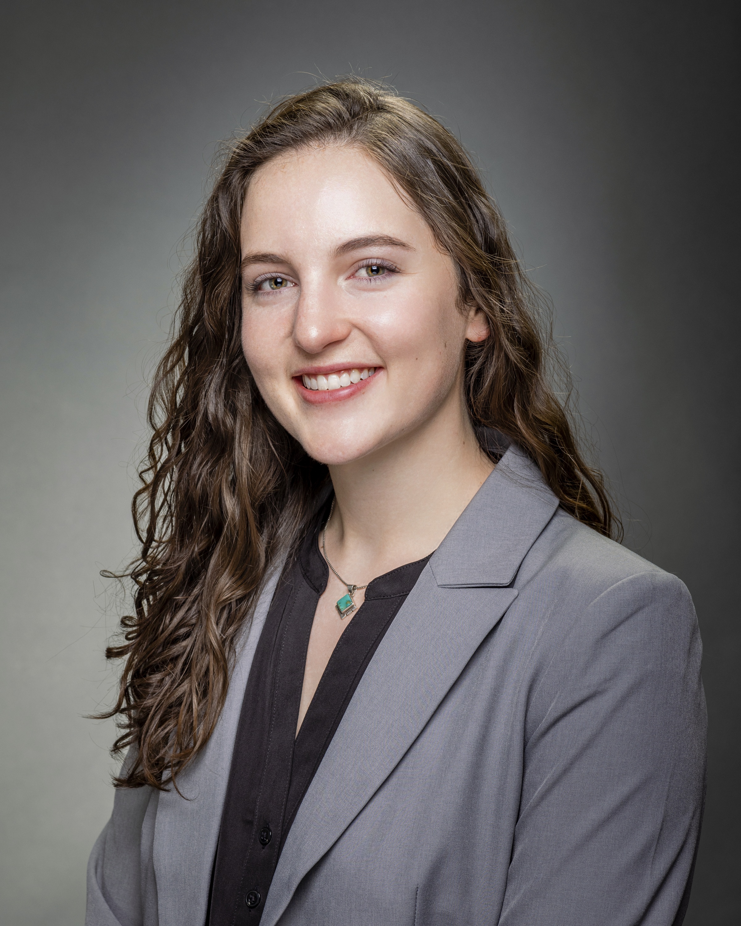 A professional young woman with dark hair