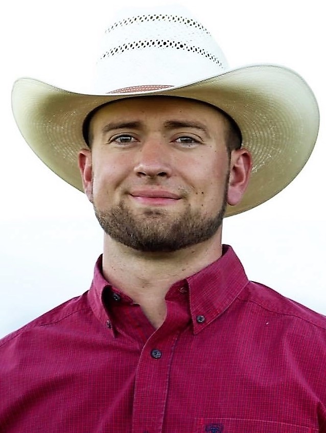 Man with dark hair and beard wearing cowboy hat