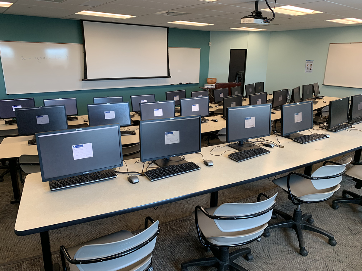 rows of desks and computers
