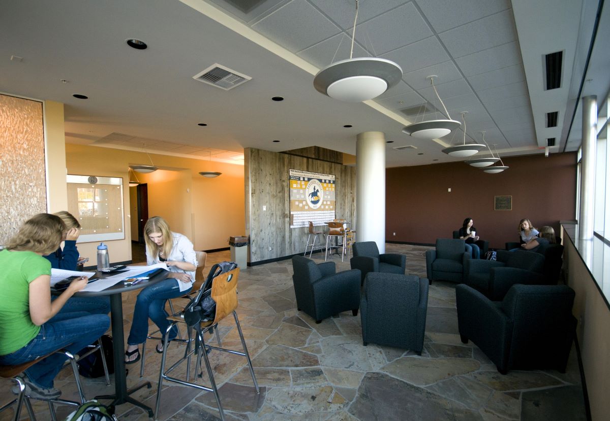 students study in a well-lit nicely appointed atrium